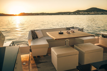 coffee on yacht at sunset