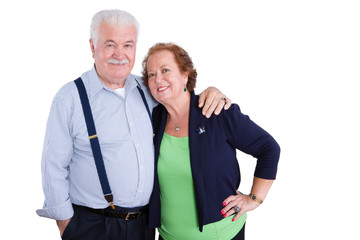 Smiling senior couple over isolated background