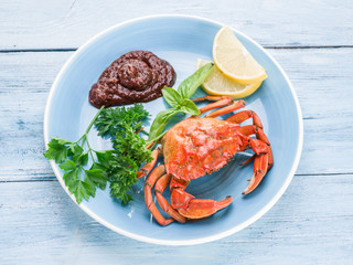 Cooked crab with lemon and herbs.