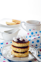 Syrniki cheese pancakes with sour cream 