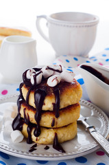 Syrniki cheese pancakes with sour cream 