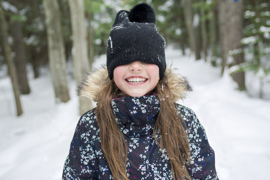 Girl in winter clothes. Happy child outside photo