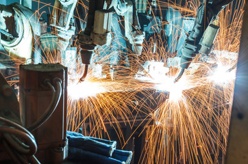 Team welding robots movement