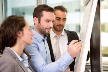 Group of business associates working together at the office