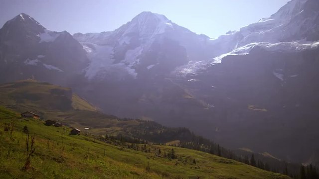 Footage of valley and Swiss Alps in the summertime