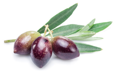 Three fresh olives with leaves on the white background.