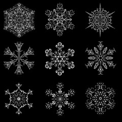 Set of snowflake icon graphic sign symbol drawing. Collection of white snowflake isolated on black background. High resolution detailed graphic illustration flake of snow