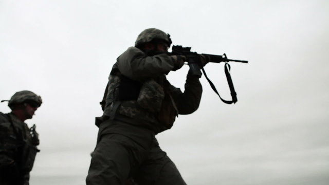 Soldier at shooting range with M4 rifle
