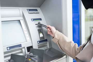Young woman using the ATM