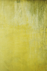 Grunge yellow cement wall background.