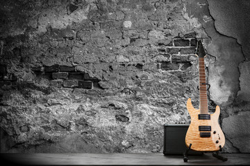 Fototapeta na wymiar Electric guitar on a brick wall background