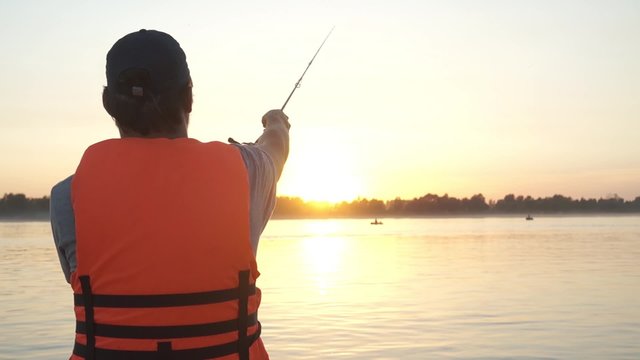 male fisherman on the boat 
