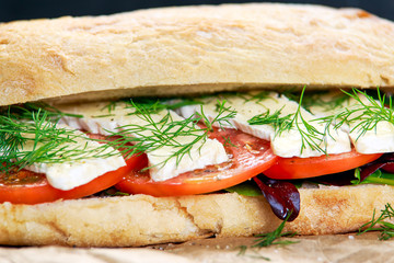 Vegetarian ciabatta, sandwich with vegetables and cheese.