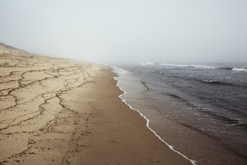 Moody, misty beach on Cape Cod at Wellfleet, Massachusetts.