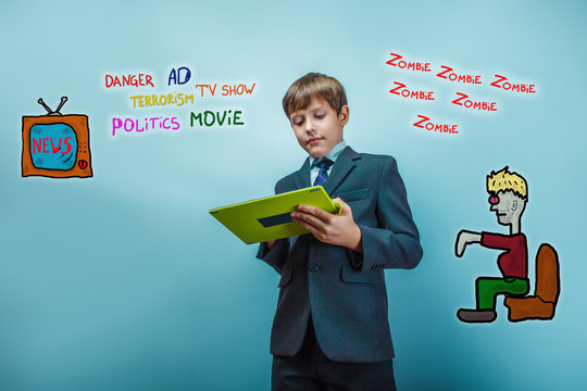 adolescent boy holds a business style tablet media influence zom