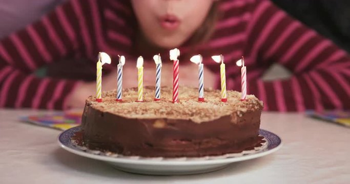 4K Cinemagraph: School Girl Blowing Candles On Her Birthday Cake