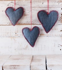 Denim hearts on a wooden background for Valentine's Day, selective focus
