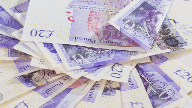 Pound sterling bank notes business background rotating, loop ready