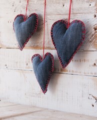 Denim hearts on a wooden background for Valentine's Day, selective focus