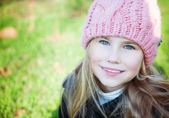 Closesup portrait  little girl in pink hat smile