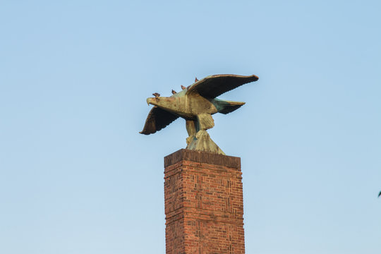 GERMANY COLOGNE FRIEDENSPARK - 2016: Hawk monument with pigeons in Friedenspark, Cologne 