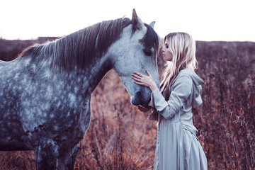  beauty blondie with horse in the field,  effect of toning