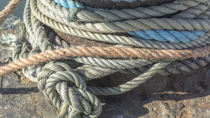 Fototapeta na wymiar Macro from different heavy duty rope on a pier