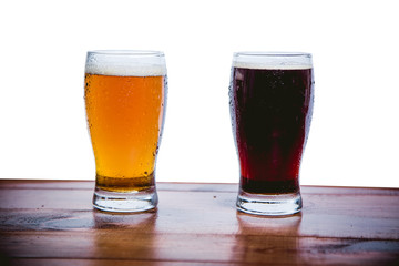 Dark and light beer on the bar on a white background