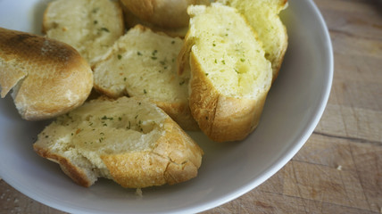 Macro from crusty garlic and herb bread