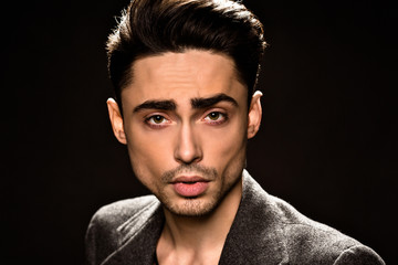 Obraz premium Portrait of model man's face in studio