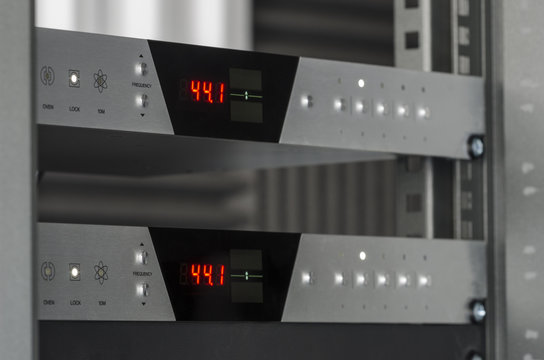 Two audio converters mounted on a rack.