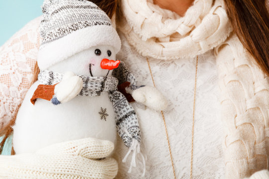 Girl with xmas snowman.