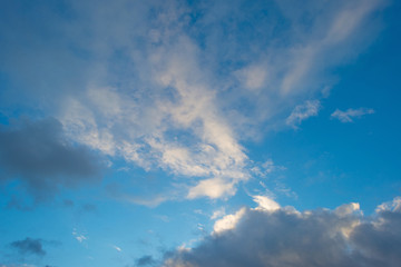 Naklejka na ściany i meble Clouds in a blue sky in winter