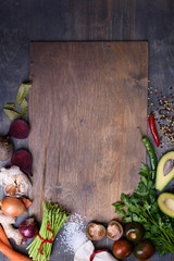 Healthy food background  on wooden board. Vegetable menu. Top view, copy space.