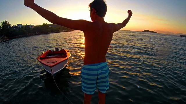 Freedom concept, successful man raising hands 