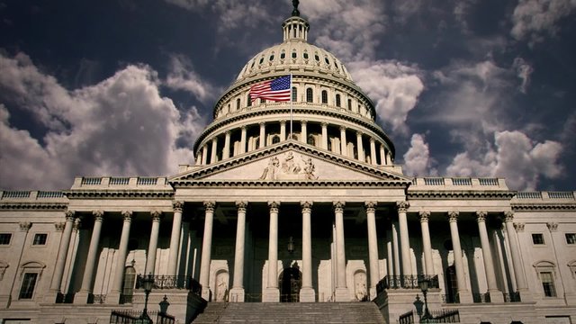 Capitol Building in Washington DC with Clouds Time lapse and Waving USA Flag.