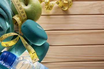 Sport and nutrition concept on wood top