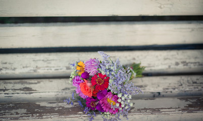 bouquet flowers on the wooden background
