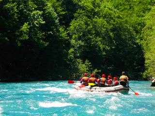 rafting boat on the fast mountain river - obrazy, fototapety, plakaty