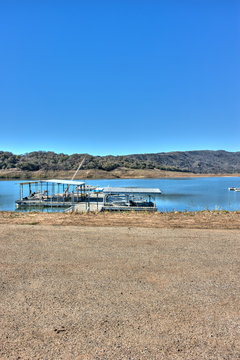 Lake Casitas boats with low water line in background.