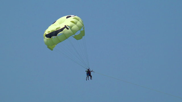 Parasailing, parascending summer fun. Color parachute 