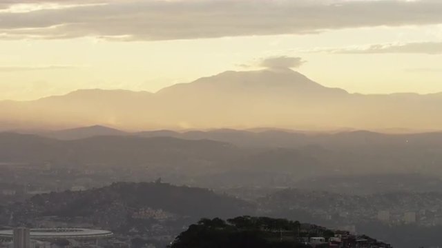 Camera pan over mountains and cityscape on a Rio de Janeiro morning