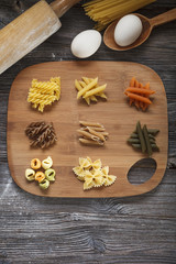 A set of raw pasta on a wooden desk