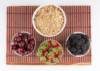 Homemade Granola and Cherries, Strawberries, and Blackberries on