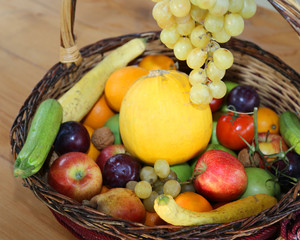 basket with lots of fresh fruit in autumn and winter season