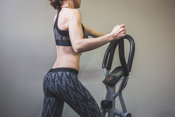 Beautiful girl doing workout in the gym