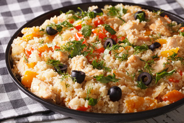 Arabic cuisine: couscous with chicken and vegetables close-up. horizontal
