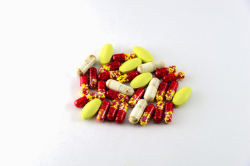 Medical pills and tablets isolated on white background.
