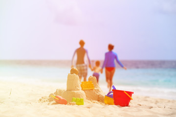 sand castle on tropical beach, family vacation