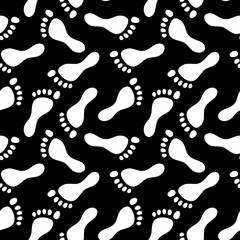 Naklejka na ściany i meble Footprints black and white seamless pattern, vector